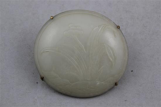 A Chinese pale celadon jade oval plaque, 18th / 19th century, 7.3cm.